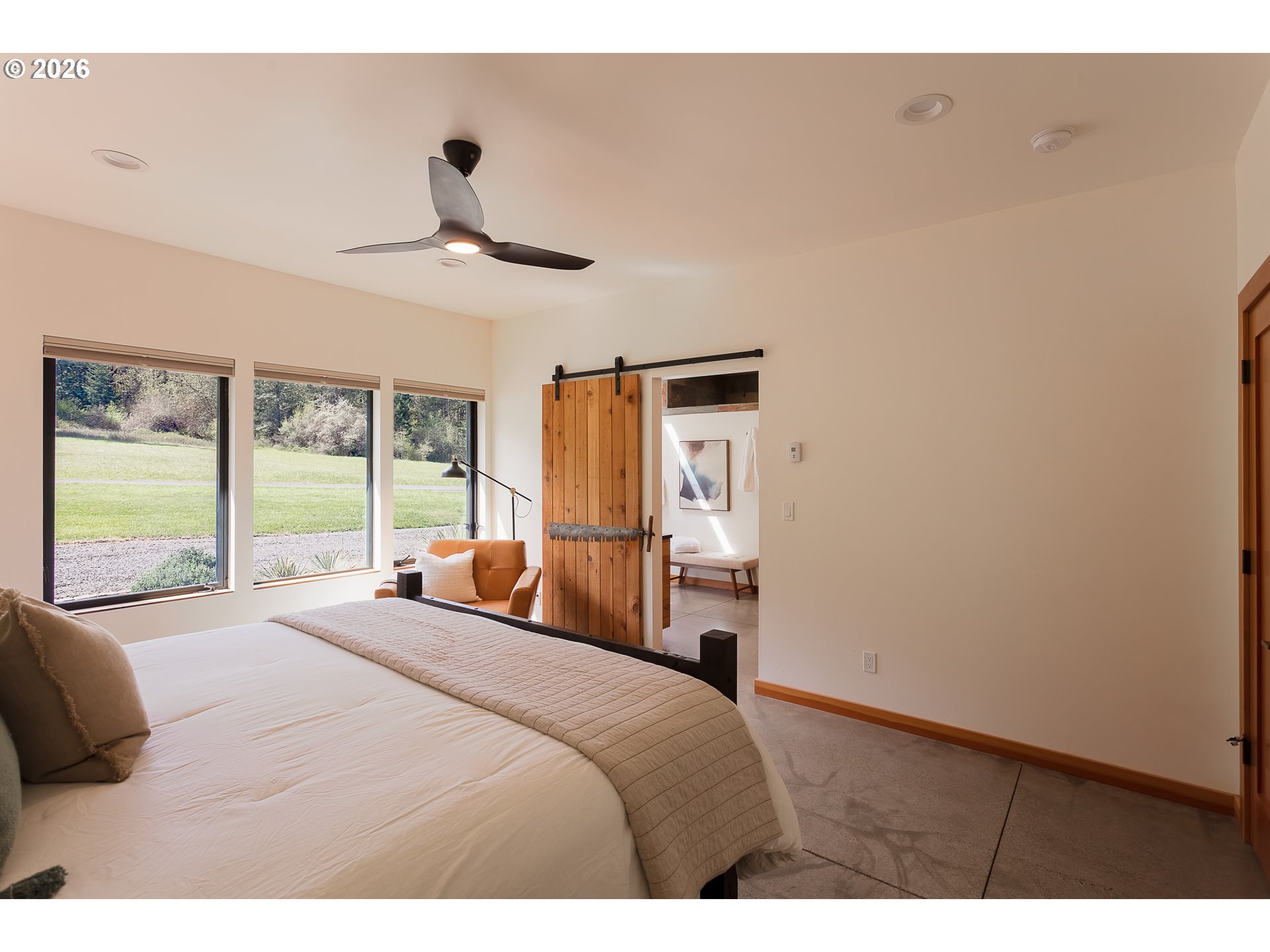 85535 Lancer Lane Eugene, OR 97405 - Photo 22 of 45 a bedroom with a large bed and a large window
