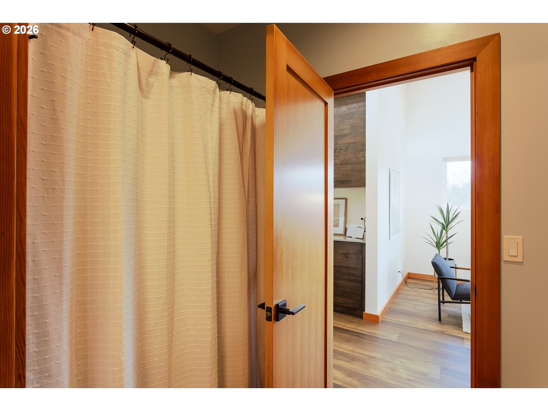 85535 Lancer Lane Eugene, OR 97405 - Photo 30 of 45 a bathroom with a shower curtain and a wooden floor