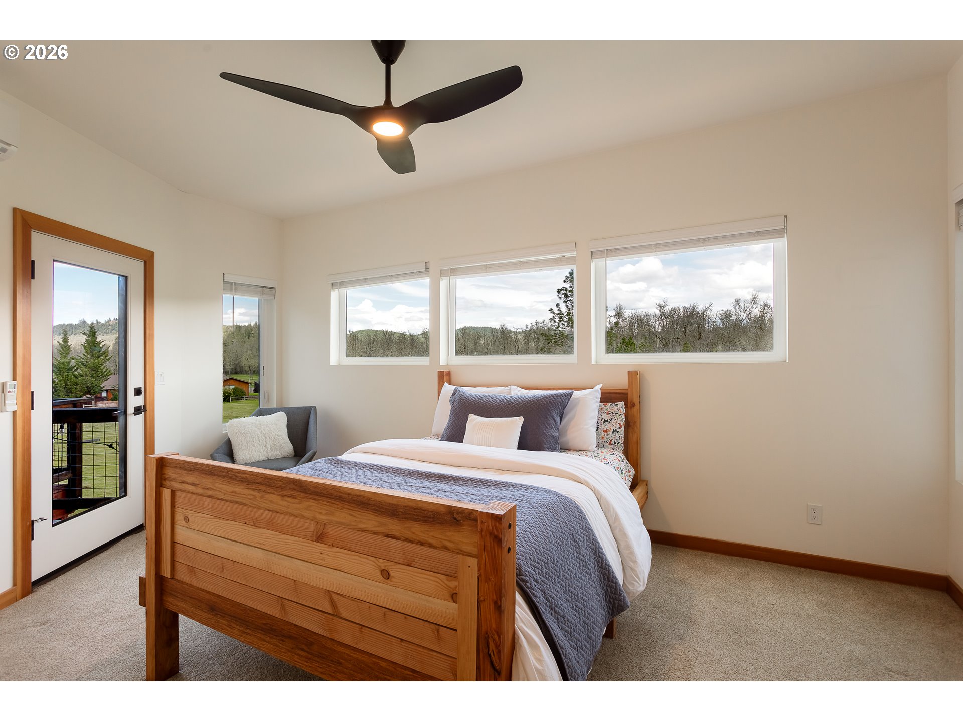 85535 Lancer Lane Eugene, OR 97405 - Photo 32 of 45 a bedroom with a large bed and a window