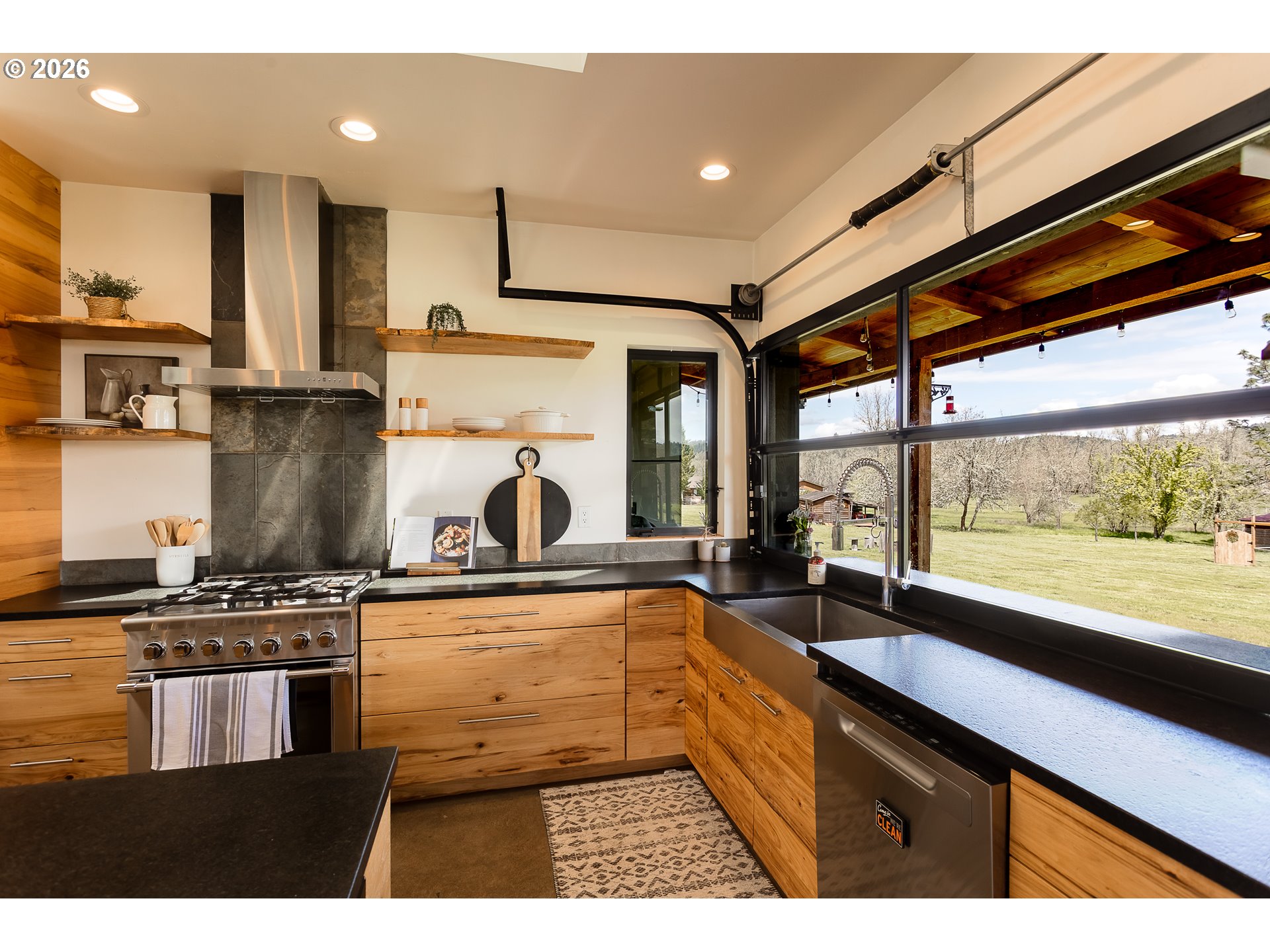 85535 Lancer Lane Eugene, OR 97405 - Photo 9 of 45 a kitchen with kitchen island granite countertop a sink a counter top space stainless steel appliances and cabinets