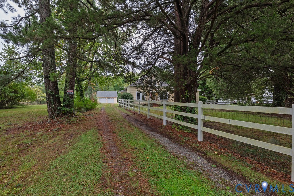 1881 Fairport Road Reedville, VA 22539 - Photo 40 of 54 Gravel driveway leading to a detached two-car gara