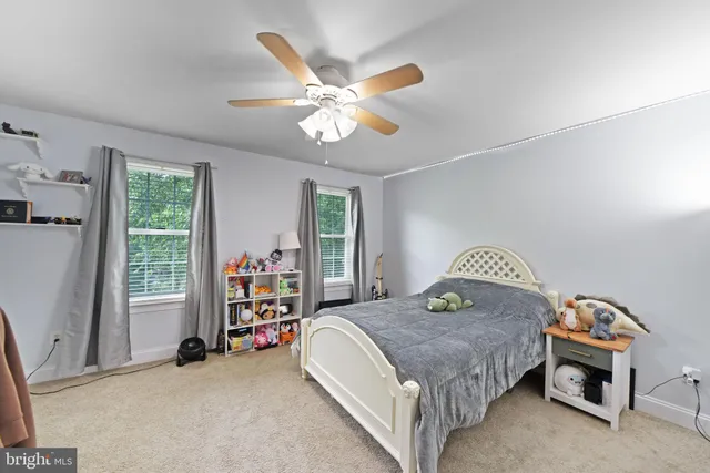 a bed room with a bed and a television