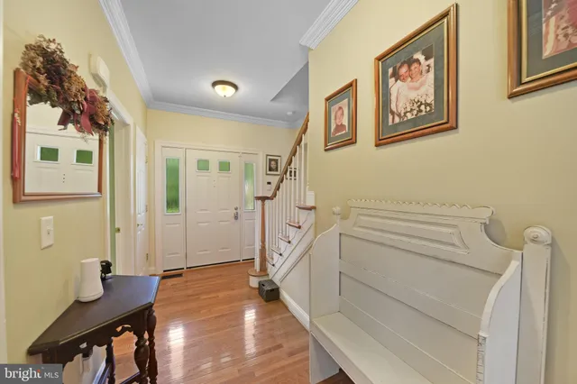 a view of a livingroom with furniture and stairs