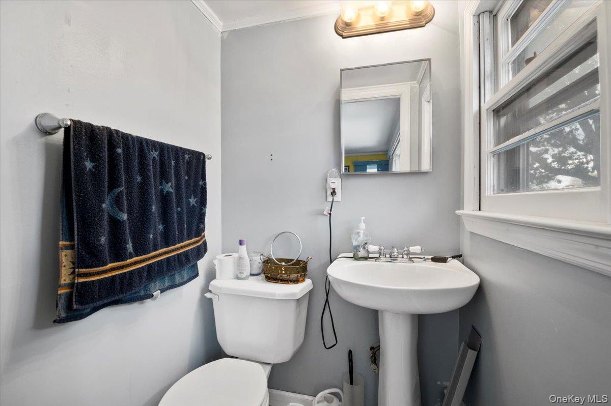 26 Bradford Lane Bethpage, NY 11714 - Photo 15 of 24 a bathroom with a sink toilet and mirror