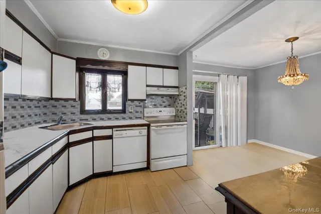 a kitchen with stainless steel appliances granite countertop a sink and cabinets