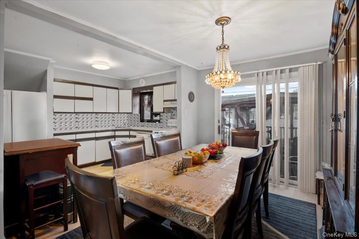 26 Bradford Lane Bethpage, NY 11714 - Photo 5 of 24 a view of a dining room with furniture window and wooden floor