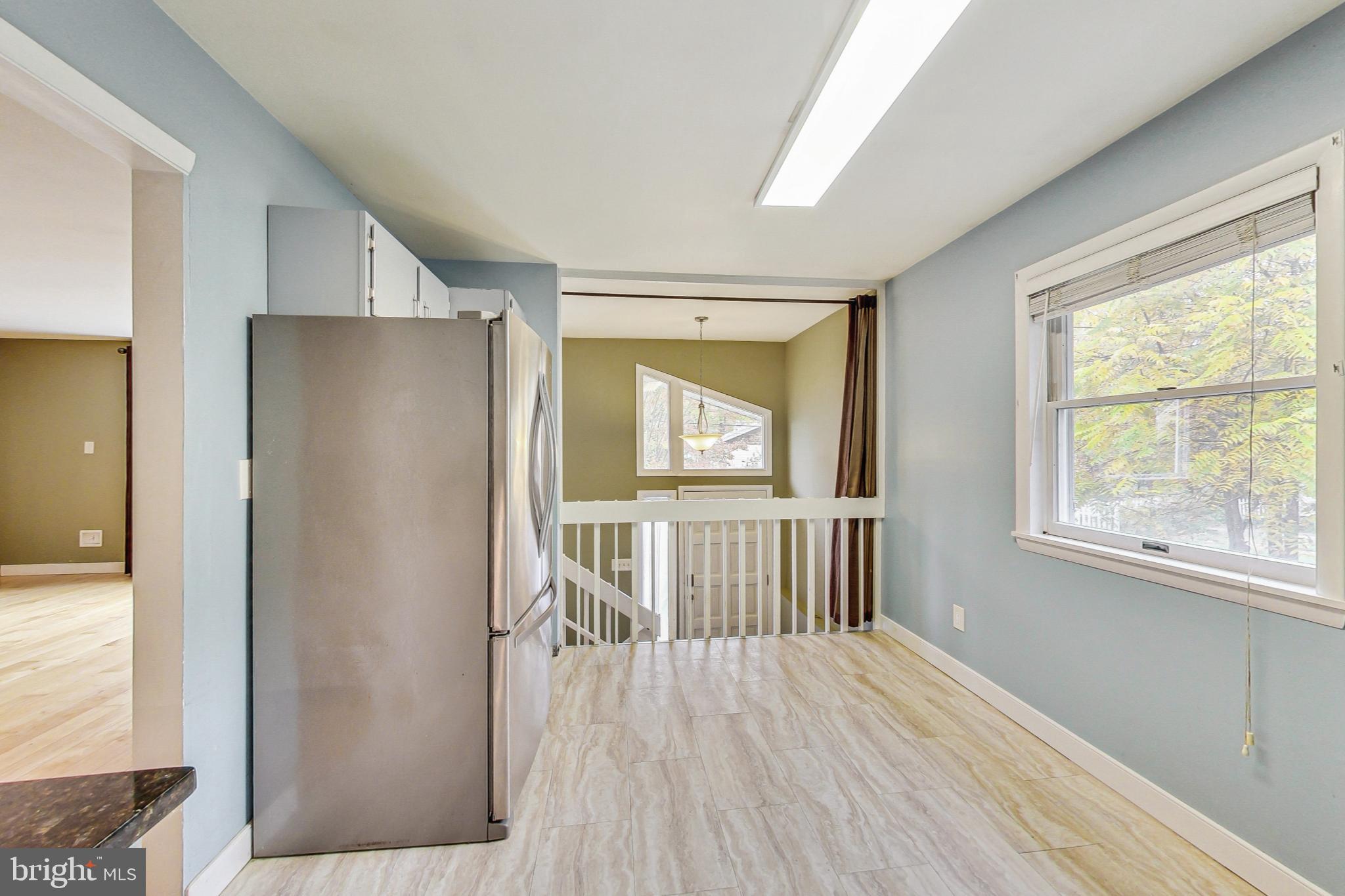 412 Walnut Drive Annapolis, MD 21403 - Photo 12 of 42 a view of empty room with wooden floor and fan