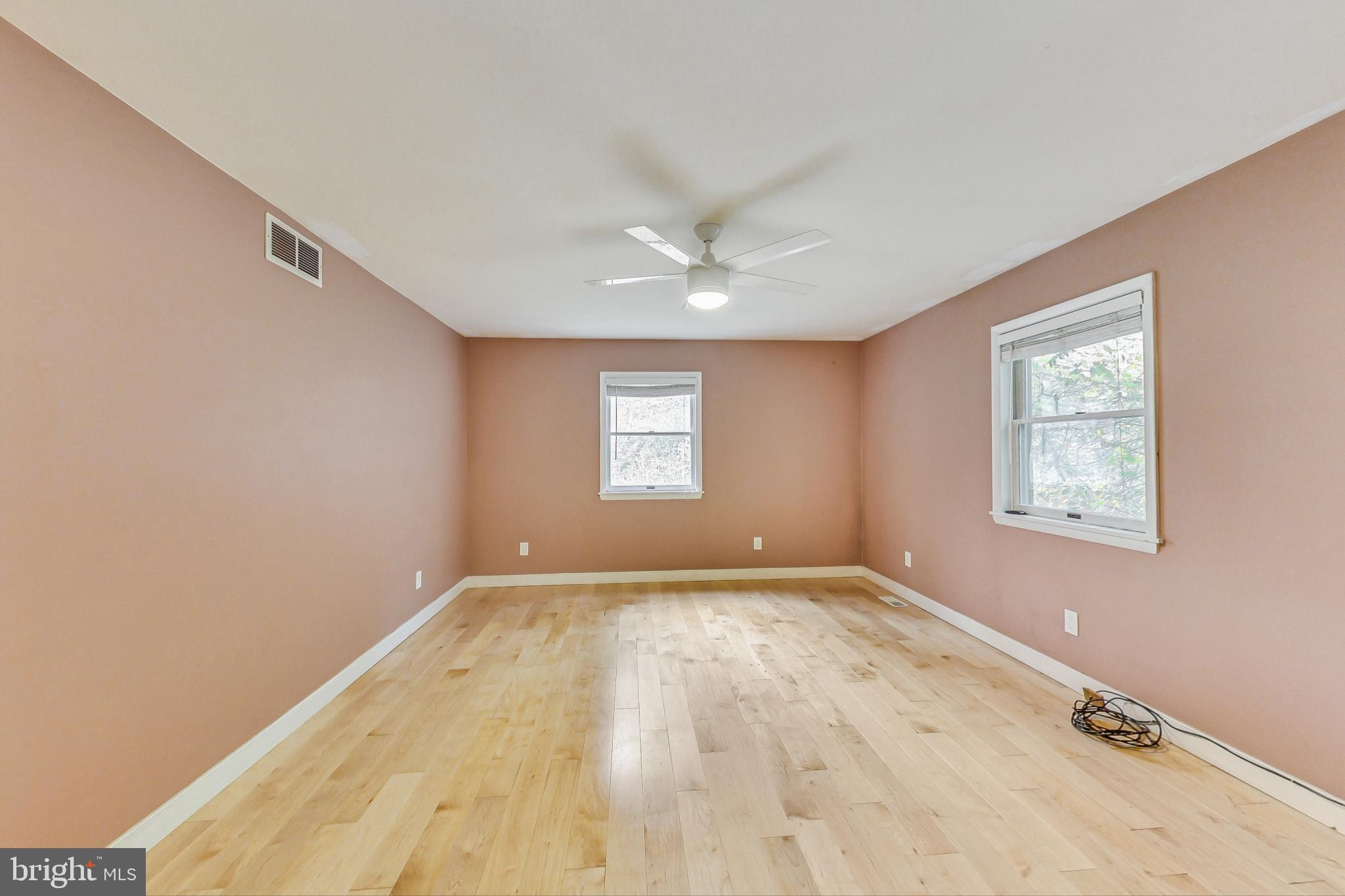 412 Walnut Drive Annapolis, MD 21403 - Photo 13 of 42 an empty room with windows and ceiling fan