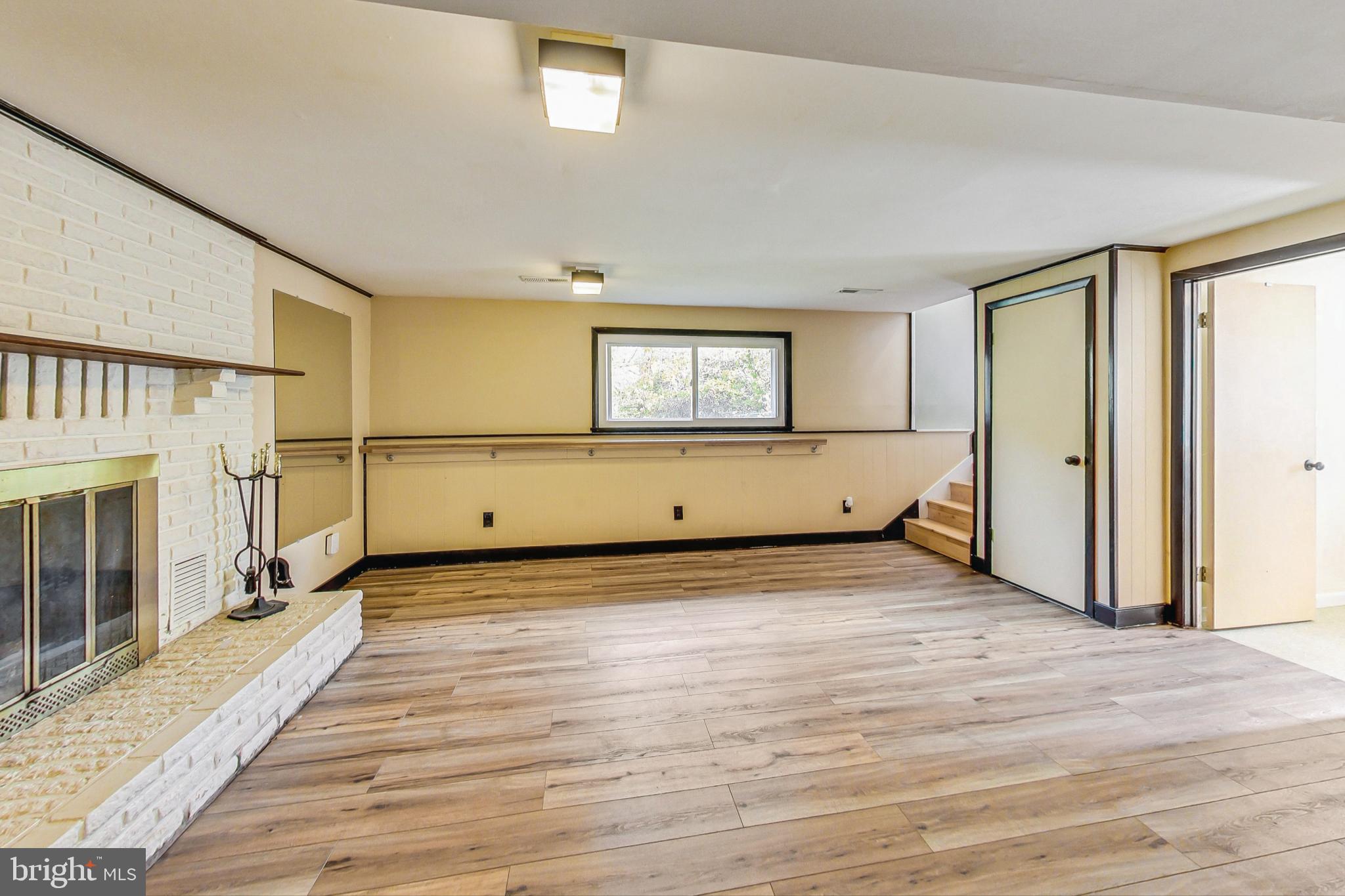 412 Walnut Drive Annapolis, MD 21403 - Photo 22 of 42 a view of an empty room with wooden floor and a window