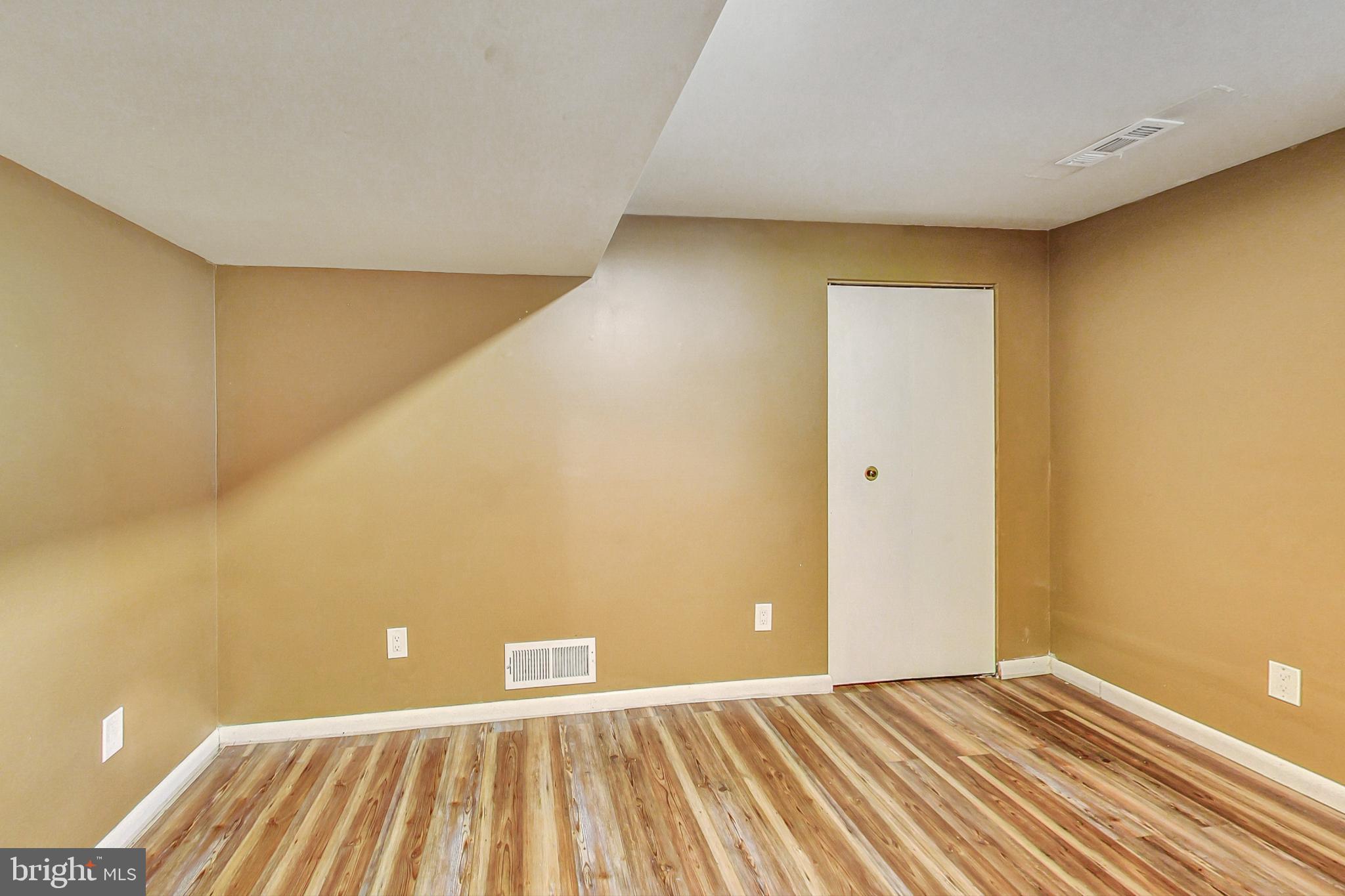 412 Walnut Drive Annapolis, MD 21403 - Photo 26 of 42 a view of an empty room with wooden floor
