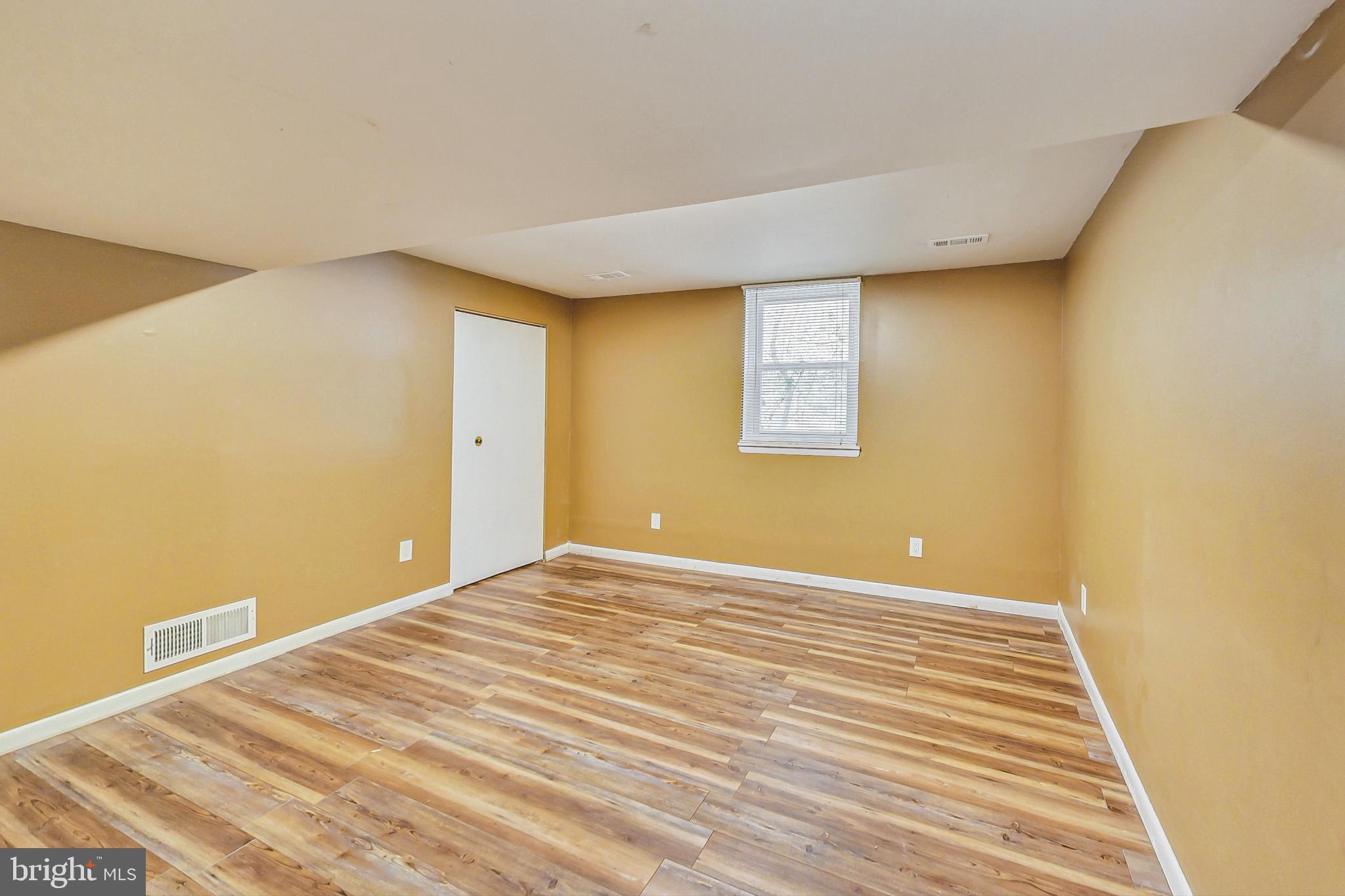 412 Walnut Drive Annapolis, MD 21403 - Photo 27 of 42 a view of an empty room with wooden floor