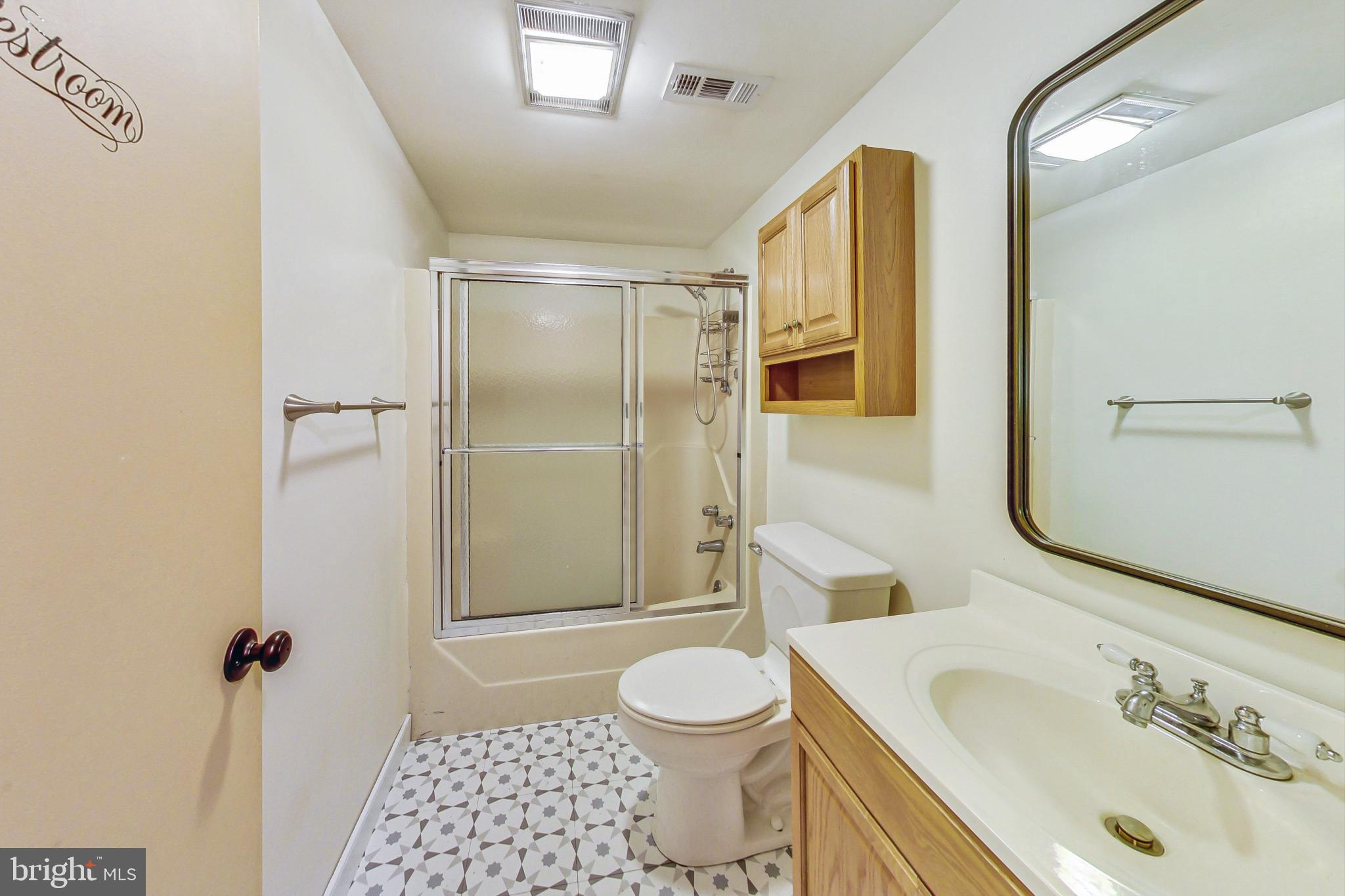 412 Walnut Drive Annapolis, MD 21403 - Photo 29 of 42 a bathroom with a sink toilet and shower