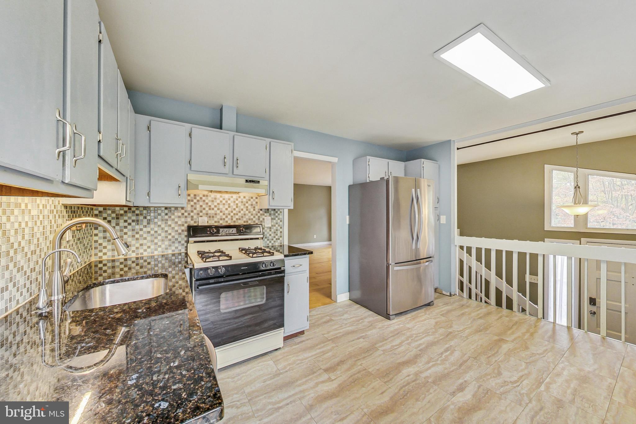 412 Walnut Drive Annapolis, MD 21403 - Photo 10 of 42 a kitchen with stainless steel appliances granite countertop a refrigerator stove top oven and sink