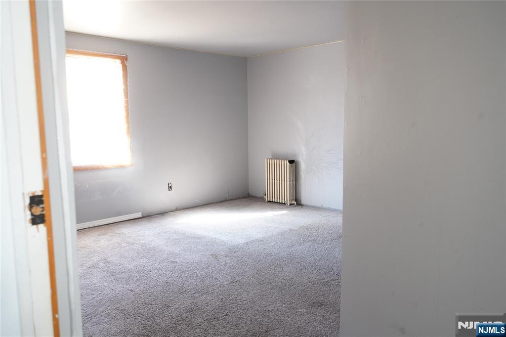 83 Roosevelt Avenue Butler, NJ 07405 - Photo 11 of 32 a view of an empty room and a window