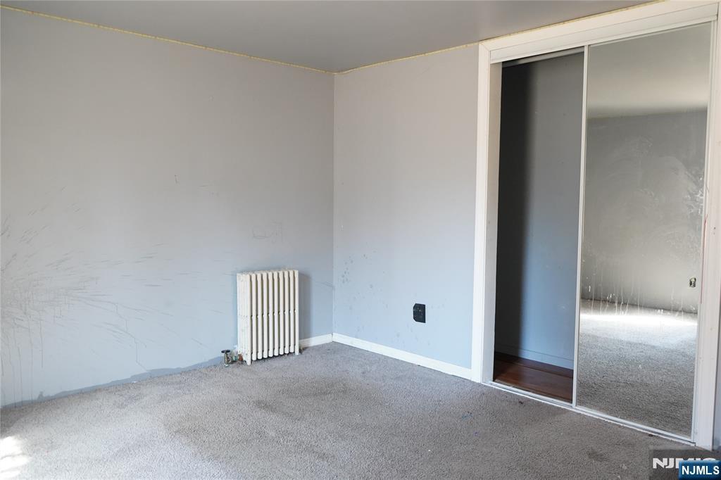 83 Roosevelt Avenue Butler, NJ 07405 - Photo 12 of 32 an empty room with closet and entryway