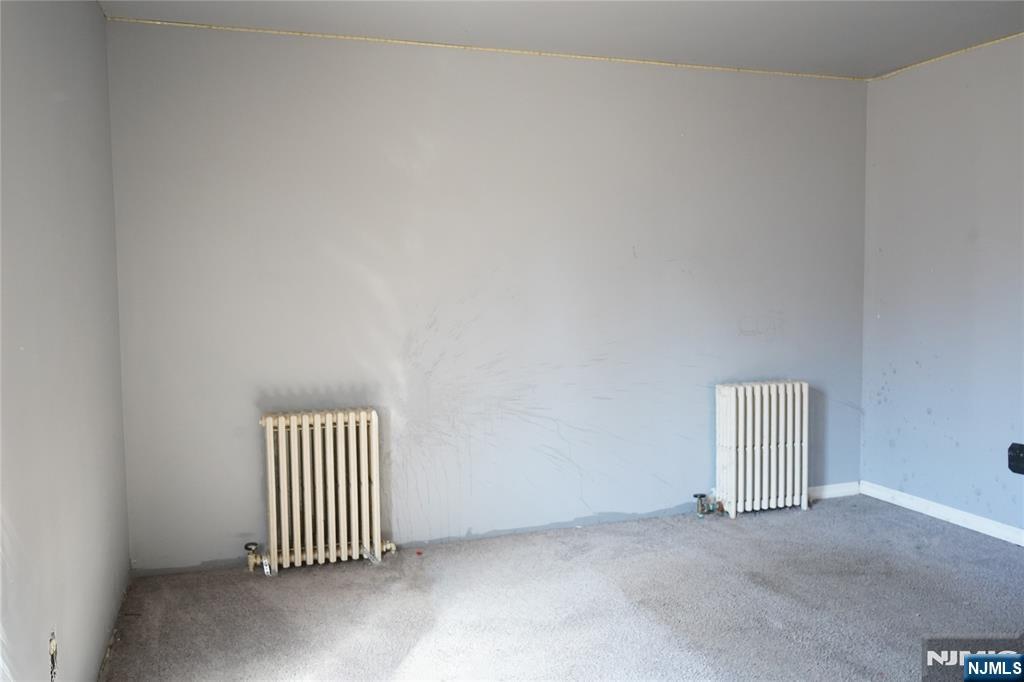 83 Roosevelt Avenue Butler, NJ 07405 - Photo 13 of 32 an empty room with a window