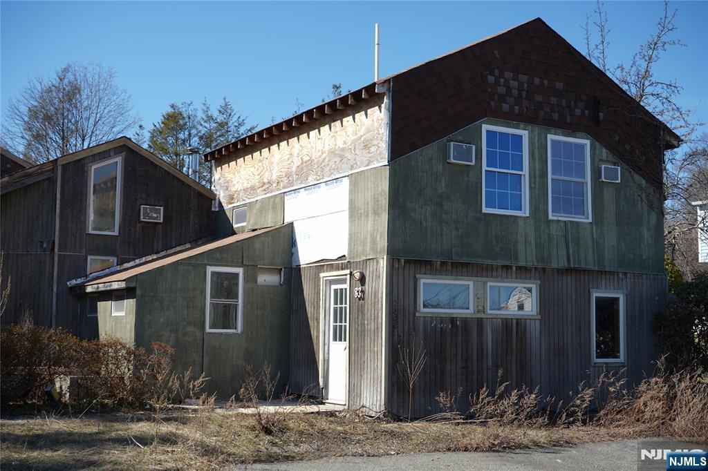 83 Roosevelt Avenue Butler, NJ 07405 - Photo 2 of 32 a front view of a house