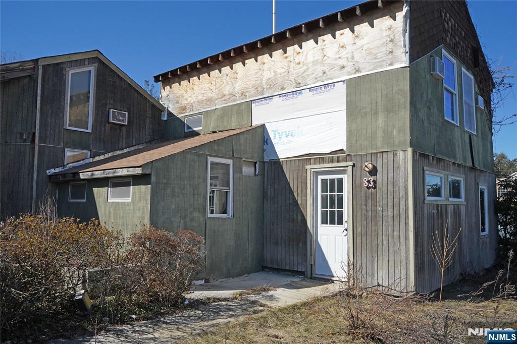 83 Roosevelt Avenue Butler, NJ 07405 - Photo 26 of 32 a view of a house with a yard