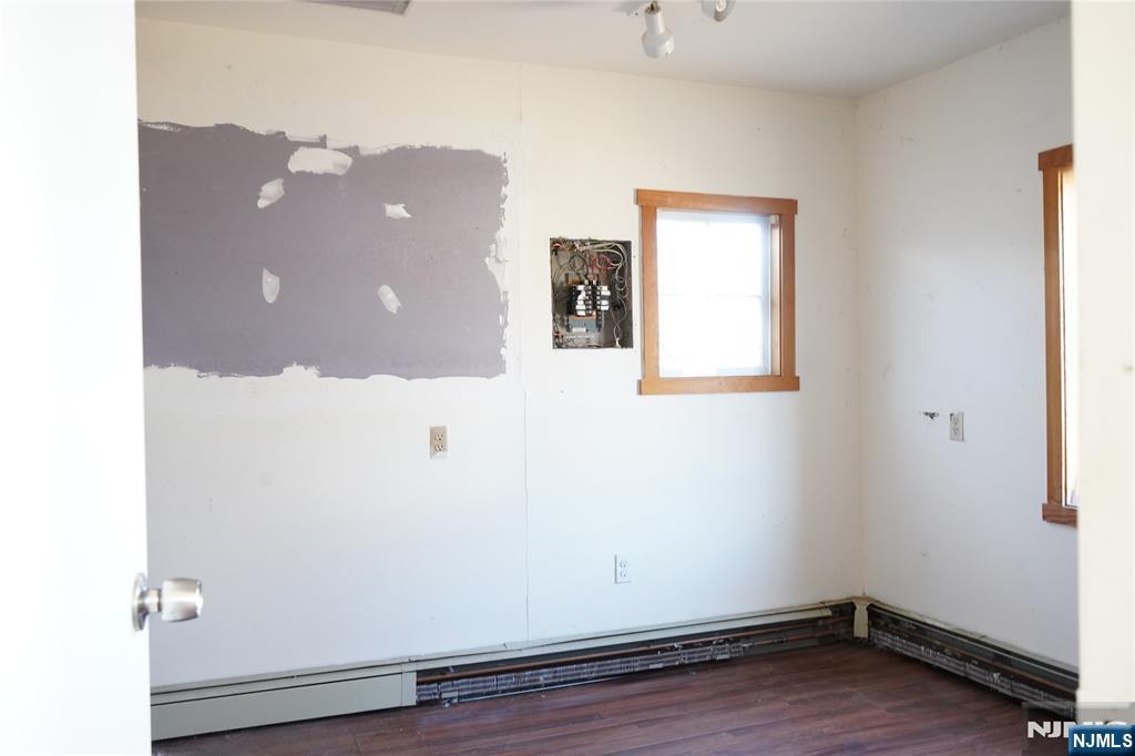 83 Roosevelt Avenue Butler, NJ 07405 - Photo 28 of 32 a view of a small space with wooden floor and mirror