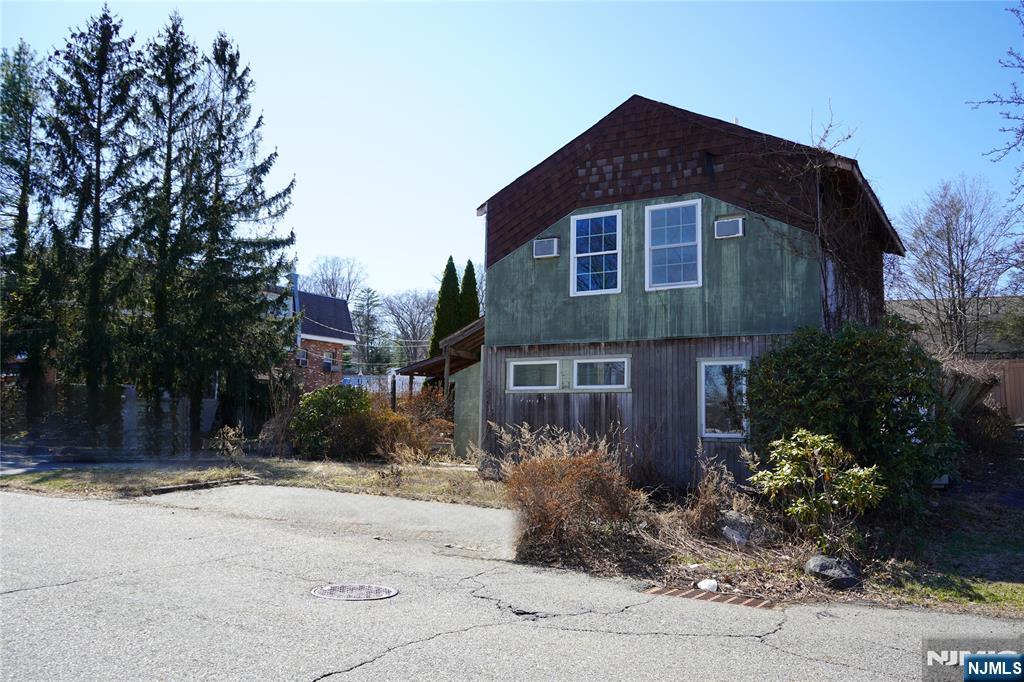 83 Roosevelt Avenue Butler, NJ 07405 - Photo 3 of 32 a front view of house with yard