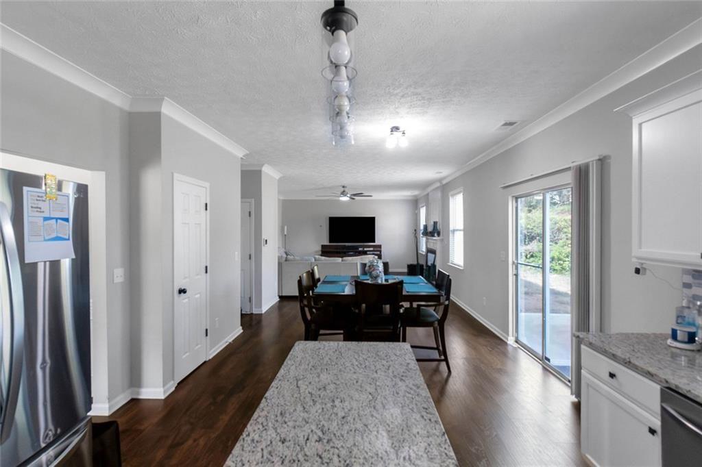 3152 Spruce Way Atlanta, GA 30349 - Photo 15 of 42 a living room with furniture wooden floor and a flat screen tv