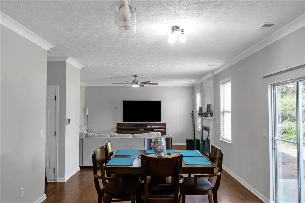 3152 Spruce Way Atlanta, GA 30349 - Photo 16 of 42 a view of a dining room with furniture window and wooden floor