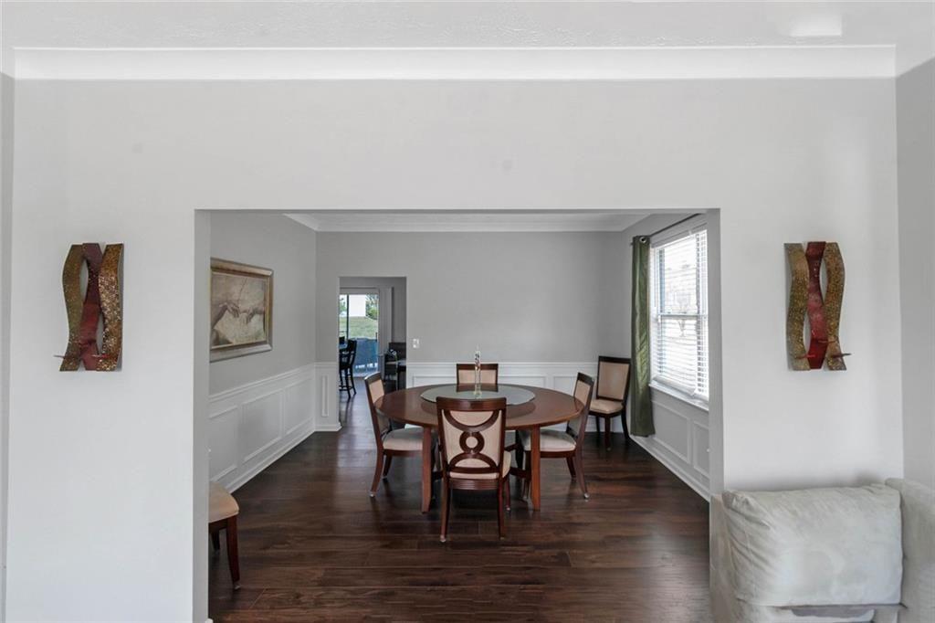 3152 Spruce Way Atlanta, GA 30349 - Photo 23 of 42 a view of a dining room with furniture and wooden floor
