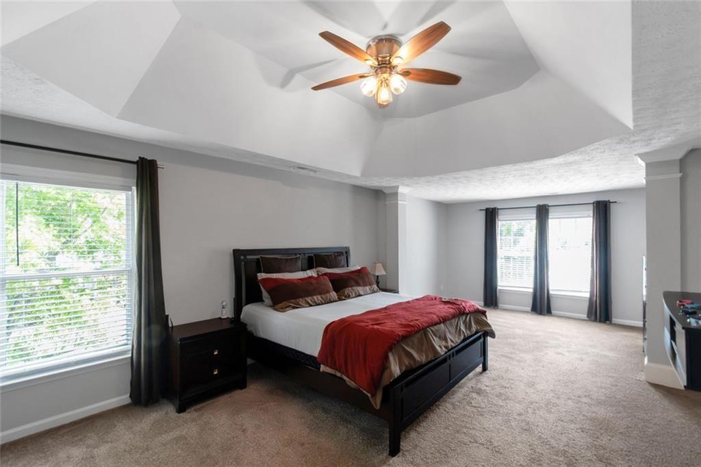 3152 Spruce Way Atlanta, GA 30349 - Photo 27 of 42 a bedroom with a bed and a large window