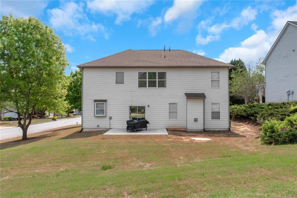 3152 Spruce Way Atlanta, GA 30349 - Photo 3 of 42 a front view of a house with a yard