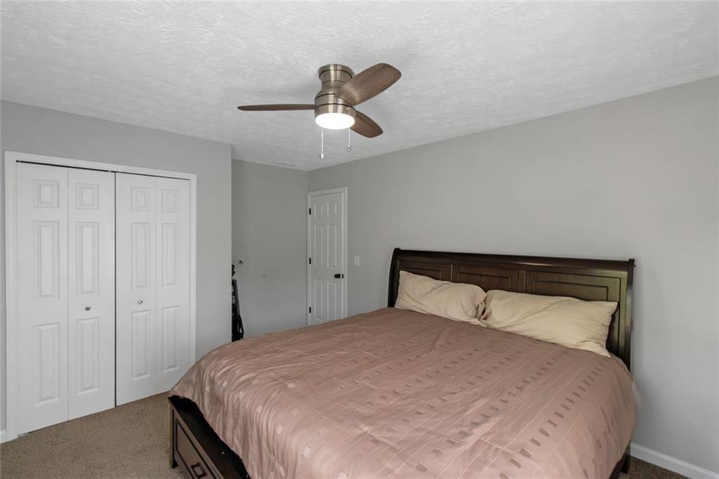 3152 Spruce Way Atlanta, GA 30349 - Photo 38 of 42 a bedroom with a bed and window