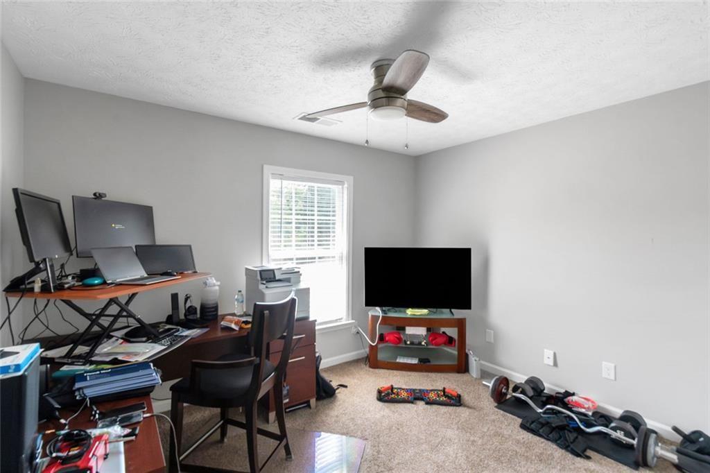 3152 Spruce Way Atlanta, GA 30349 - Photo 42 of 42 a view of a workspace with furniture and a window