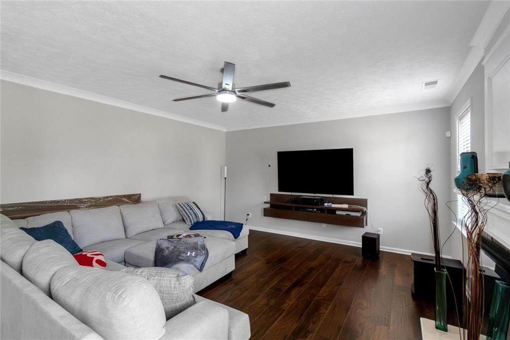 3152 Spruce Way Atlanta, GA 30349 - Photo 7 of 42 a living room with furniture and a flat screen tv