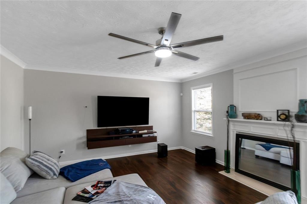 3152 Spruce Way Atlanta, GA 30349 - Photo 8 of 42 a living room with furniture and a flat screen tv