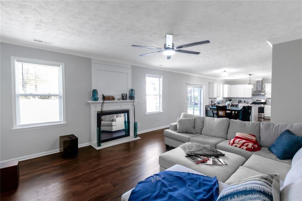 3152 Spruce Way Atlanta, GA 30349 - Photo 9 of 42 a living room with furniture and a fireplace