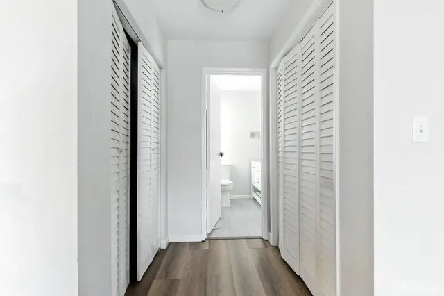 a view of a bathroom from a hallway