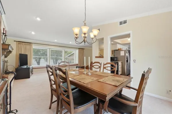 a view of a dining room with furniture window and outside view