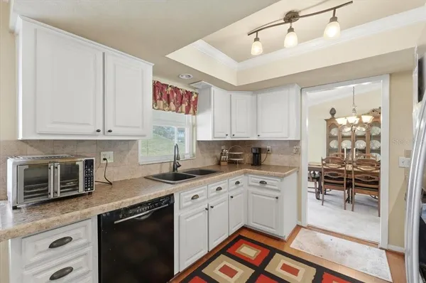 a kitchen that has a stove and a microwave