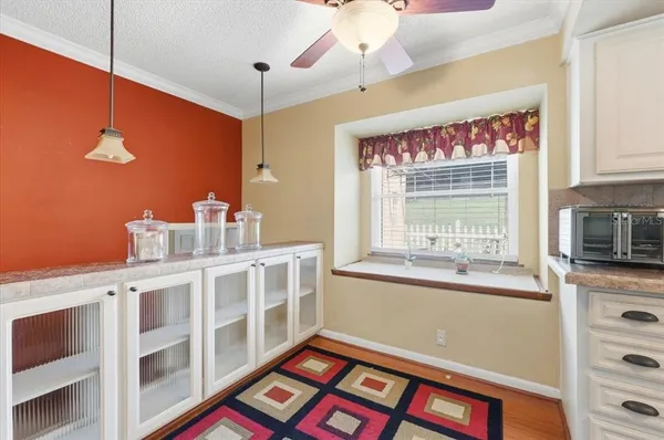 a kitchen with stainless steel appliances granite countertop a sink a stove and a refrigerator