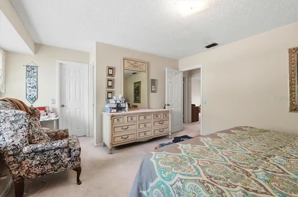 a bedroom with a bed and a cabinets
