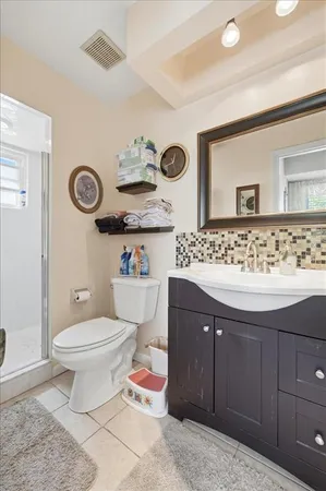 a bathroom with a sink a mirror and shower