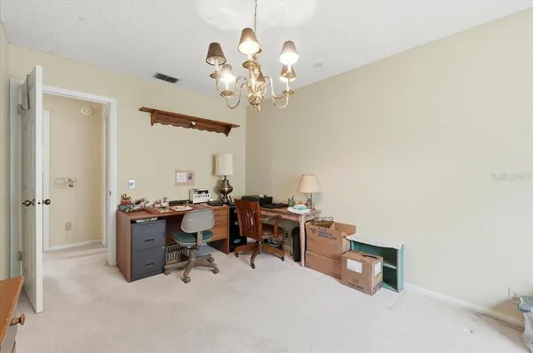 a bedroom with a bed and a large closet