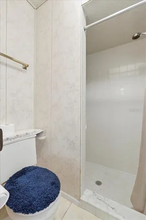 a view of a house with backyard and a tree