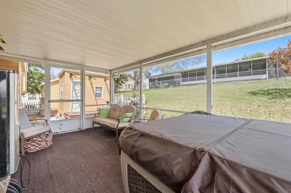 a view of a swimming pool with an outdoor space and seating area