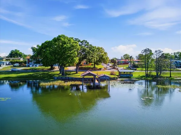 a view of a lake with houses swimming pool and outdoor space