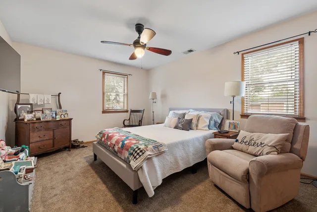 a bedroom with a bed furniture and window