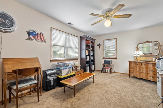a living room with furniture and a window
