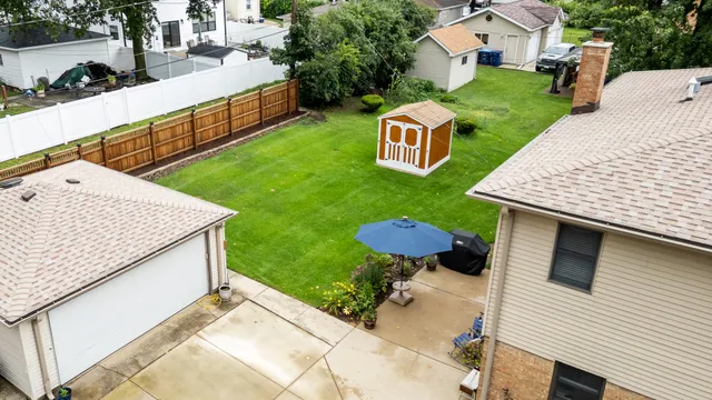 a view of an house with backyard space and patio