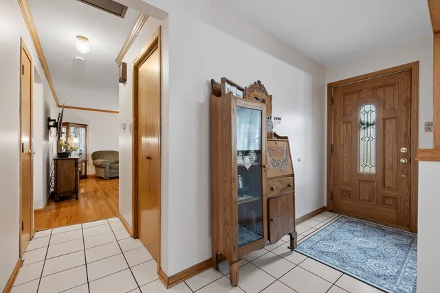 a view of a hallway with living room and furniture