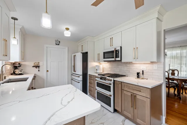 a kitchen with a sink stove and refrigerator