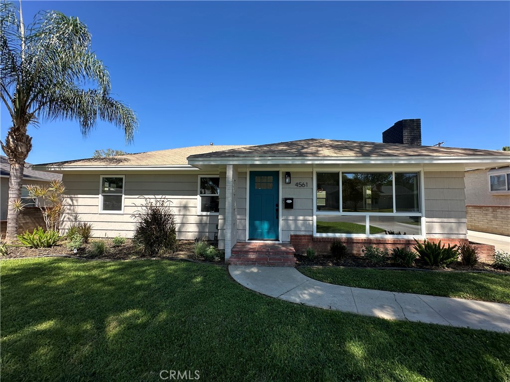 4561 Cover Street Riverside, CA 92506 - Photo 2 of 47 a front view of a house with a yard and potted plants